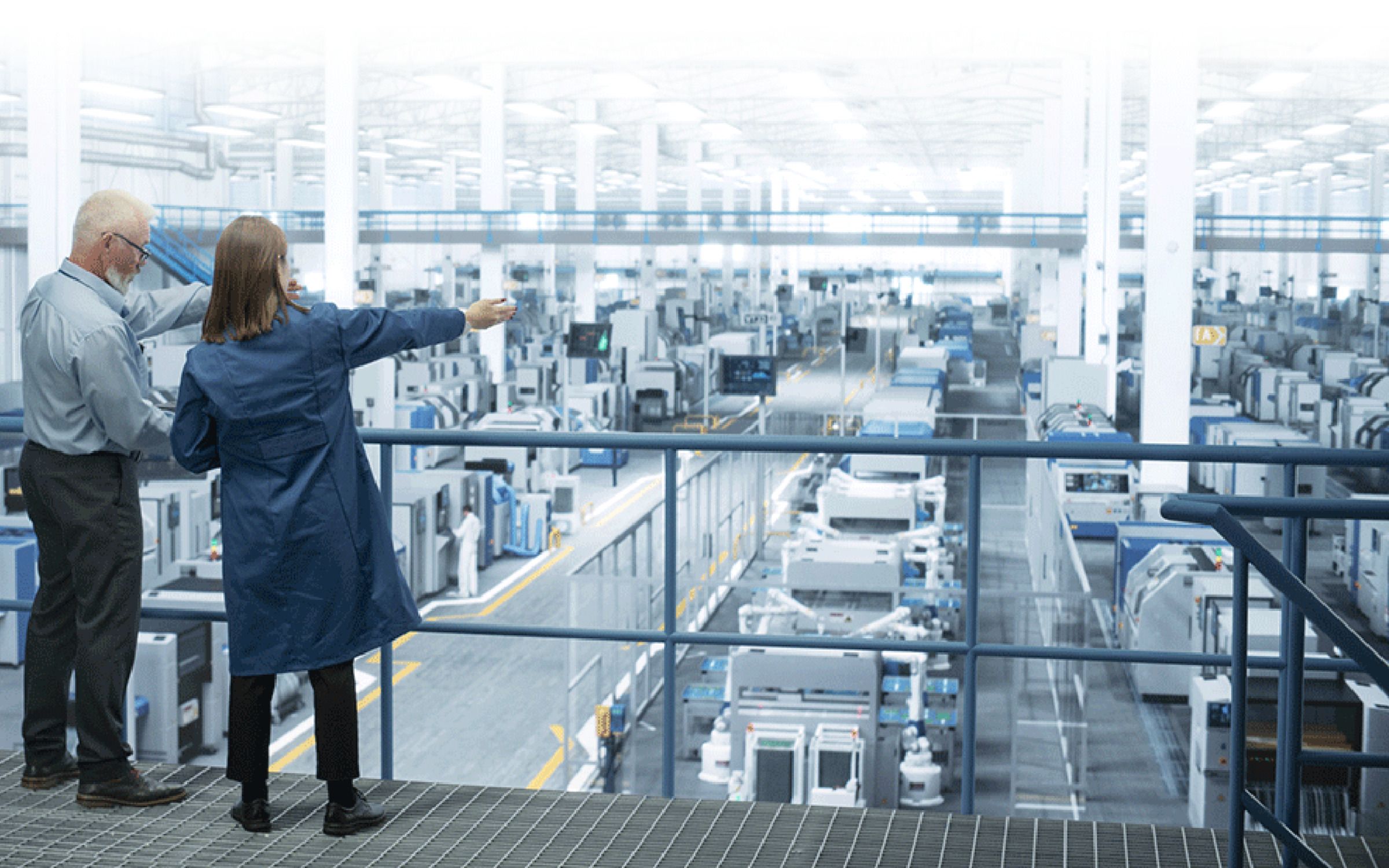 engineers talking in manufacturing plant